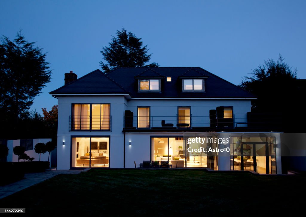 Modern house illuminated at night