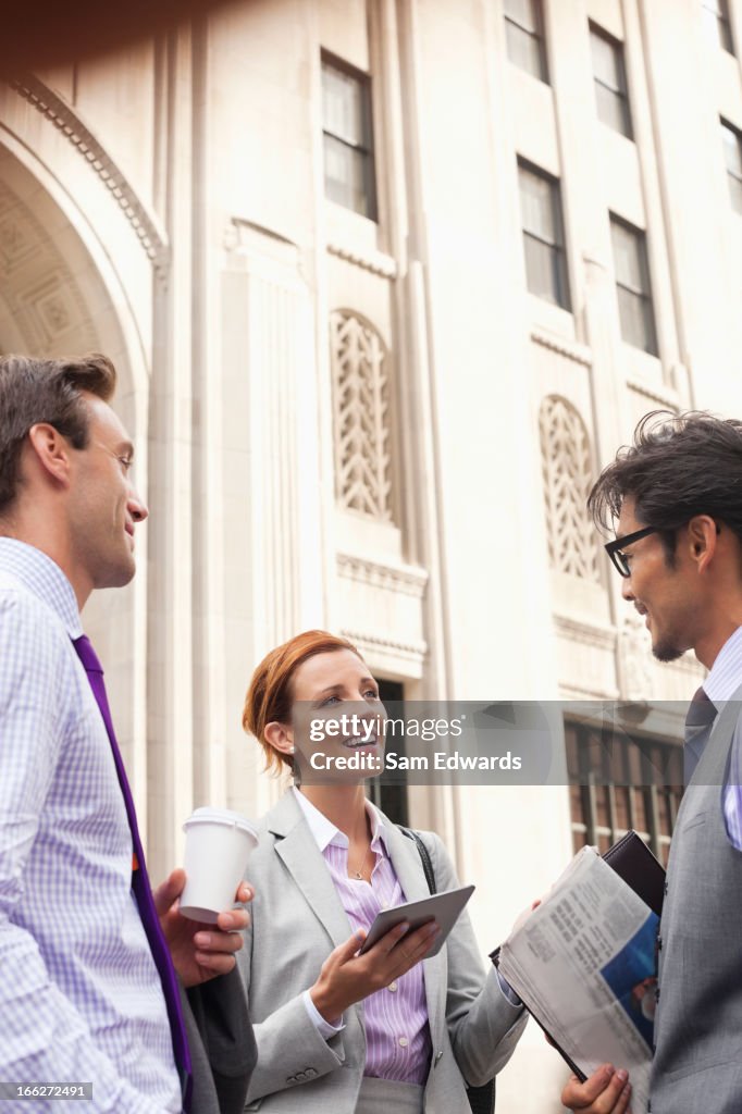 Business people talking on city street