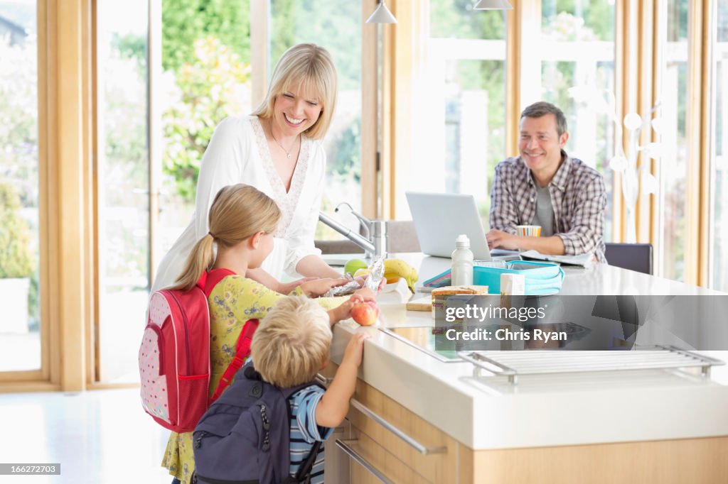 Family talking in kitchen