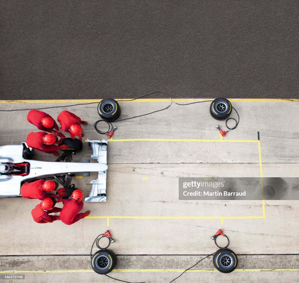 Racing team working at pit stop