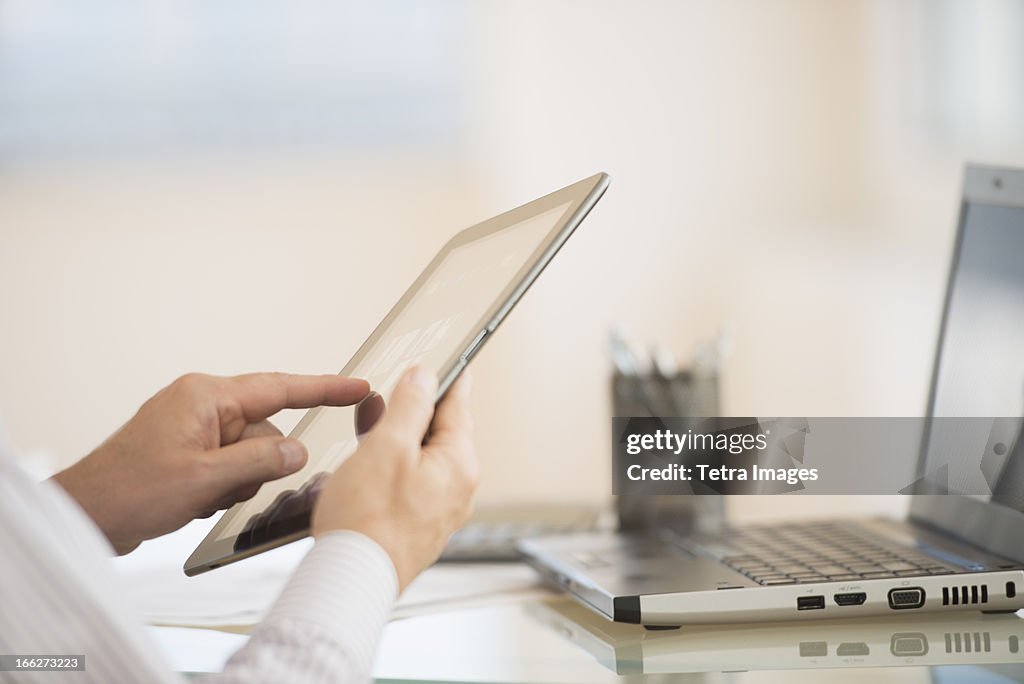 USA, New Jersey, Jersey City, Man using tablet pc