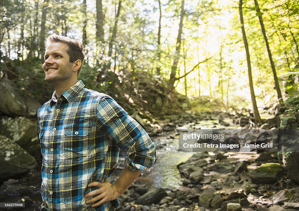 USA, Connecticut, Newtown, Man standing in forest
