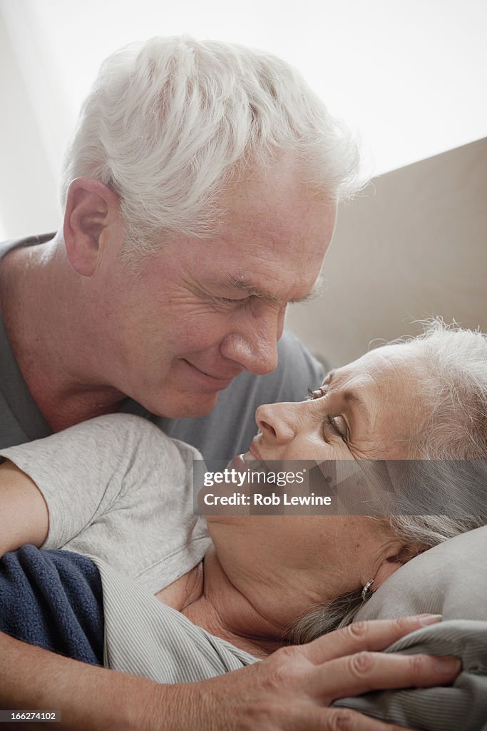 Senior couple smiling and embracing