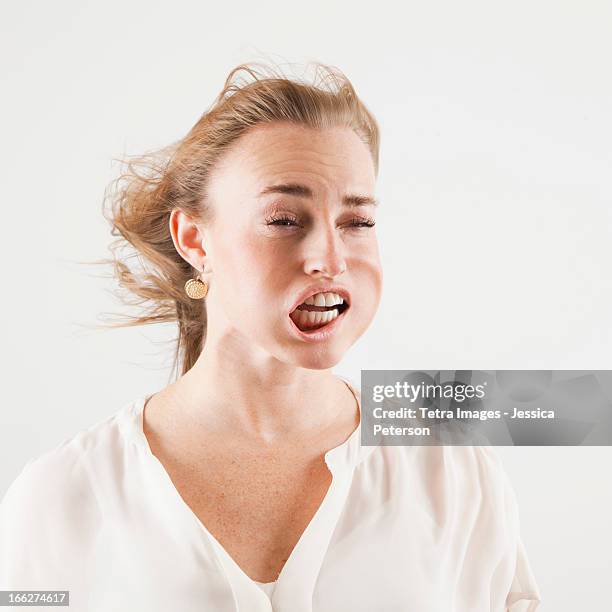 studio shot of woman with windblown mouth - ugly woman 個照片及圖片檔