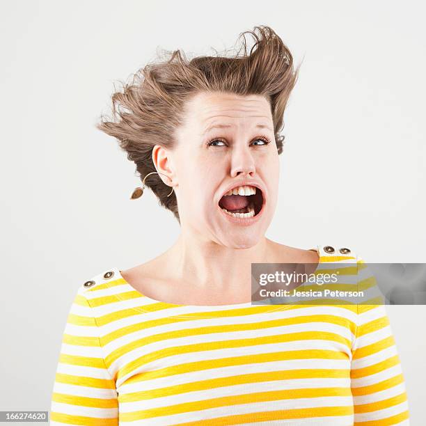 studio shot of woman with windblown mouth - ugly woman 個照片及圖片檔