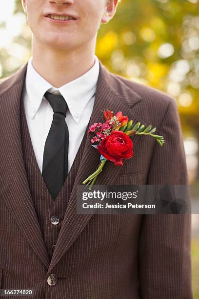 usa, utah, provo, mid section of groom wearing full suit decorated with boutonniere - utah wedding stock pictures, royalty-free photos & images