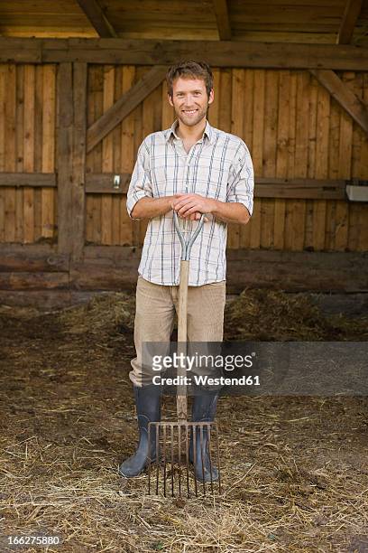 farmer with hayfork - pitchfork stock pictures, royalty-free photos & images