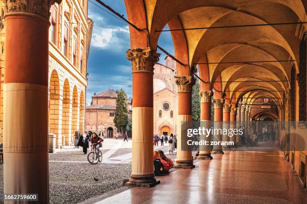 colonnade in portici in historical pedestrian zone in bologna, italy - veranda bildbanksfoton och bilder