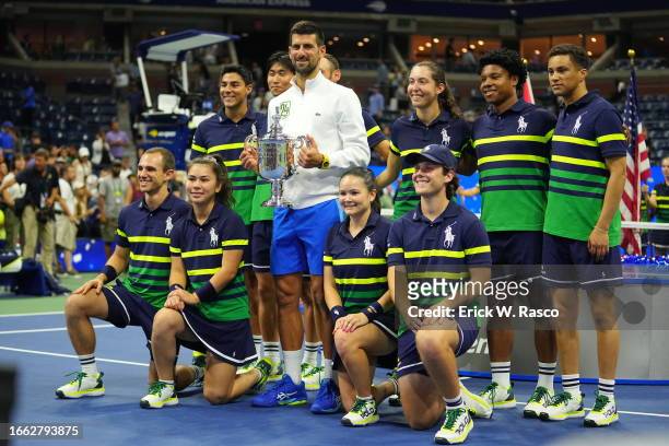 Serbia Novak Djokovic in action, poses with the Champions trophy after defeating Russia Daniil Medvedev during the Men's Singles Finals match at...