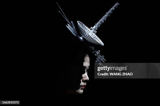 Model displays a creation from the Saint Joy collection by Bian Huizhong during the China Fashion Week in Beijing on September 13, 2023.