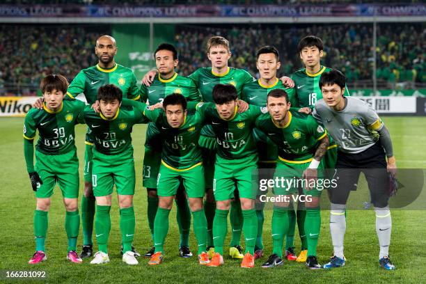 Beijing Guoan players line up prior to the AFC Champions League Group match between Beijing Guoan and Bunyodkor at Beijing Workers' Stadium on April...