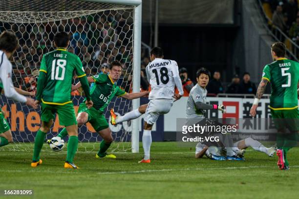 Fozil Musaev of Bunyodkor scores his team's first goal during the AFC Champions League Group match between Beijing Guoan and Bunyodkor at Beijing...