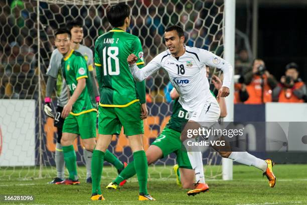 Fozil Musaev of Bunyodkor celebrates after scoring his team's first goal during the AFC Champions League Group match between Beijing Guoan and...