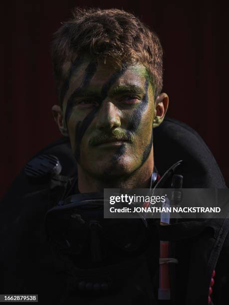 Diver from the US Marine Corps is pictured as he participates in the military exercise Archipelago Endeavor 23 on Mallsten island in the Stockholm...