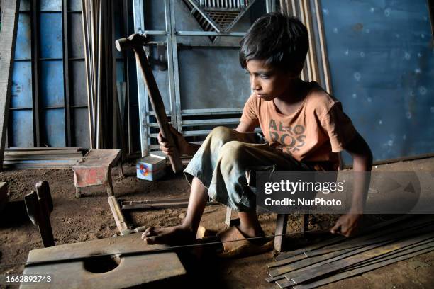 Shohel works at a metal workshop in Dhaka, Bangladesh, on September 13 earning a monthly income ranging from 20 to 25 USD after putting in 8 to 12...