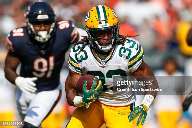 Green Bay Packers running back Aaron Jones carries the ball on a running play in the first half during a regular season game between the Green Bay...
