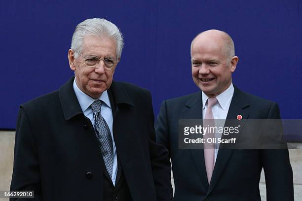 Italian Prime Minister Mario Monti is greeted by British Foreign Secretary William Hague outside Lancaster House on April 11, 2013 in London,...