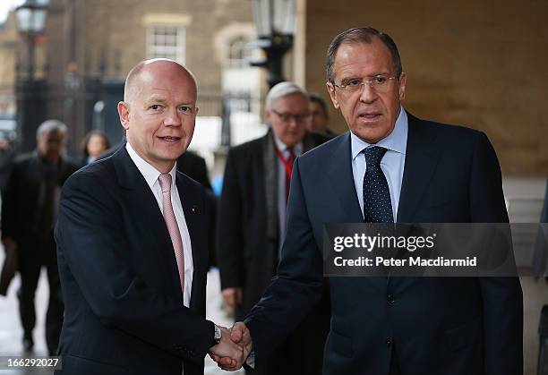 British foreign Secretary William Hague greets Russian Foreign Minister Sergey Lavrov at the G8 Foreign Ministers meeting at Lancaster House on April...