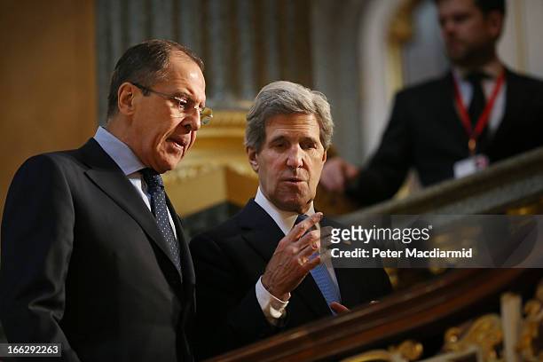 Secretary of State John Kerry walks with Russian Foreign Minister Sergey Lavrov at the G8 Foreign Ministers meeting at Lancaster House on April 11,...