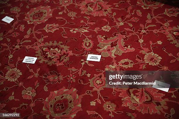 Labels mark the positions of Foreign Ministers from France, The United States, The United Kingdom and Russia for a group photograph during the...