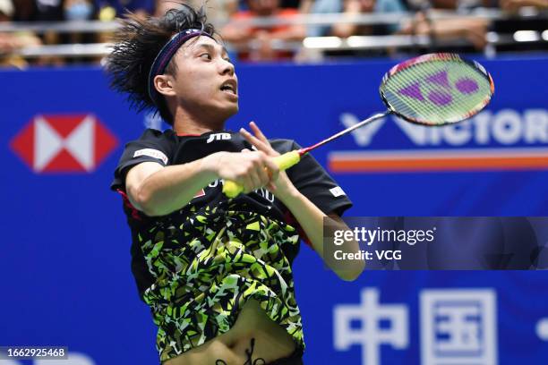 Kodai Naraoka of Japan competes in the Men's Singles first round match against Lee Zii Jia of Malaysia on day 2 of the Victor China Open 2023...