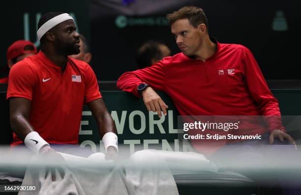 Frances Tiafoe speaks to captain Bob Bryan of USA during his match against Borna Gojo of Croatia on the 2023 Davis Cup Finals Group D Stage match...