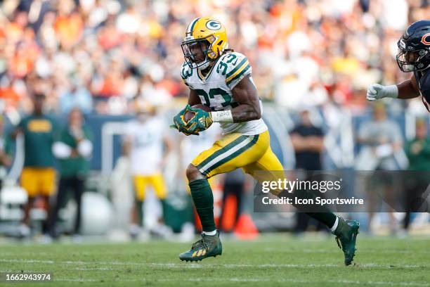 Green Bay Packers running back Aaron Jones carries the ball on a running play in the second half during a regular season game between the Green Bay...