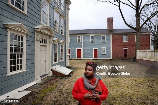 Boston, MA Executive Director Kyera Singleton poses for a portrait while touring the Royall House and Slave Quarters. At left is the Big House, where...