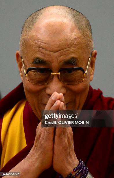 The Tibetan spiritual leader Dalai Lama takes place for a press conference on April 11, 2013 in Trento, after receiving the award of Minorities by...
