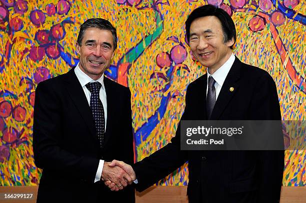 Anders Fogh Rasmussen , the NATO Secretary General, shakes hands with South Korean foreign minister Yun Byung-Se during their meeting at the Ministry...