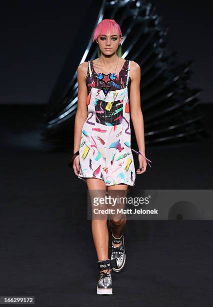 Model showcases designs on the runway at the Emma Mulholland show during Mercedes-Benz Fashion Week Australia Spring/Summer 2013/14 at Carriageworks...