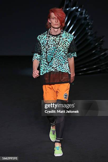 Model showcases designs on the runway at the Emma Mulholland show during Mercedes-Benz Fashion Week Australia Spring/Summer 2013/14 at Carriageworks...