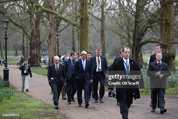 Secretary of State John Kerry walks through Green Park with colleagues and security on April 11, 2013 in London, England. G8 Foreign Ministers are...