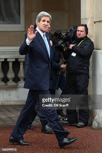 Secretary of State John Kerry waves as he leaves Lancaster House on April 11, 2013 in London, England. G8 Foreign Ministers are holding a two day...