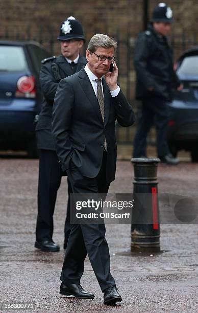 German Foreign Minister Guido Westerwelle speaks on his mobile phone outside Lancaster House on April 11, 2013 in London, England. G8 Foreign...