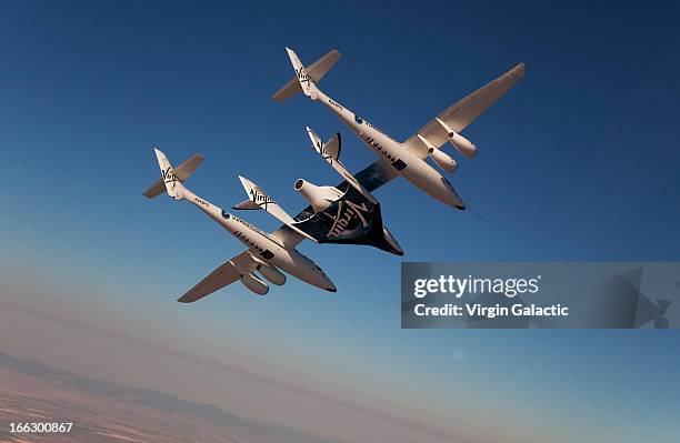 Virgin Galactic vehicles WhiteKnightTwo and SpaceShipTwo in flight during captive carry test flight at Mojave on July 15, 2010 in California.