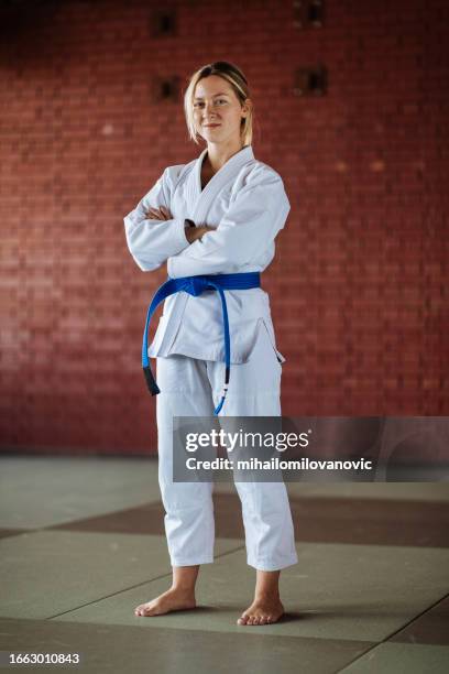 wearing a kimono - women judo stock pictures, royalty-free photos & images