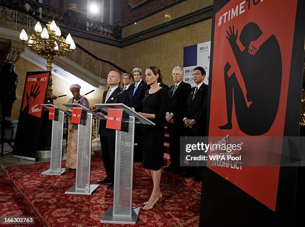 Actress Angelina Jolie in her role as UN envoy, talks during a news conference regarding sexual violence against women in conflict, as British...