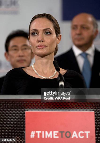 Actress Angelina Jolie, in her role as UN envoy, talks during a news conference regarding sexual violence against women in conflict, at the Foreign...