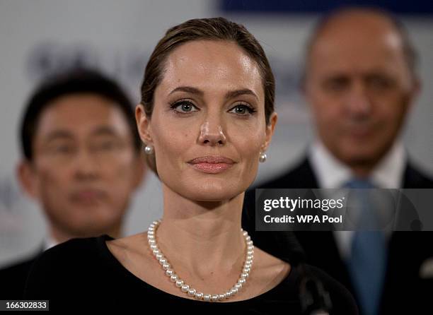 Actress Angelina Jolie, in her role as UN envoy, talks during a news conference regarding sexual violence against women in conflict, at the Foreign...