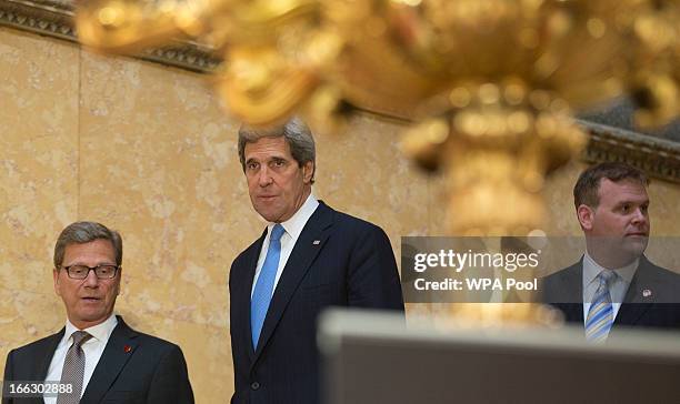 Secretary of State John Kerry German Foreign Minister Guido Westerwelle and Canadian Foreign Minister John Baird walk down the stairs for a press...