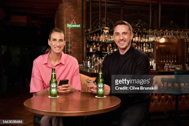 In this image released on September 14 Football pundits Jill Scott MBE and Gary Neville sit in a bar with two bottles of Heineken. Jill and Gary...