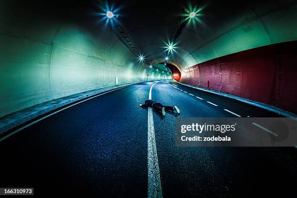 dead man in the tunnel, roadkill - crossing the road stock pictures, royalty-free photos & images