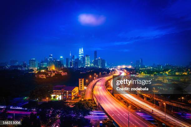 kuala lumpur cityscape by night, malaysia - kuala lumpur road stock pictures, royalty-free photos & images