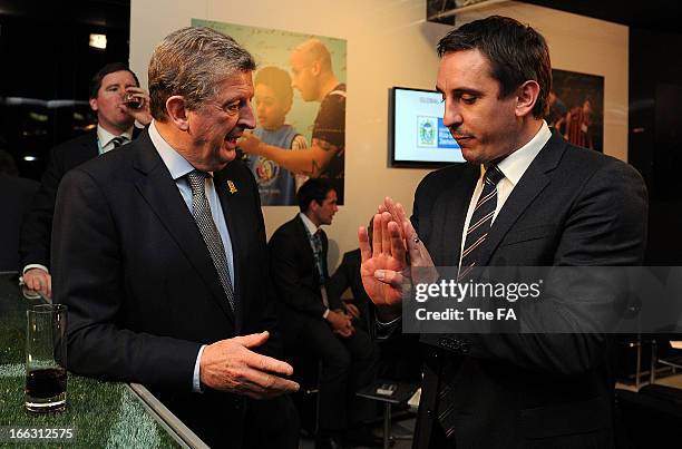 In this handout image provided by The FA, England manager Roy Hodgson speaks with Gary Neville in the FA150 lounge during the Soccerex European Forum...