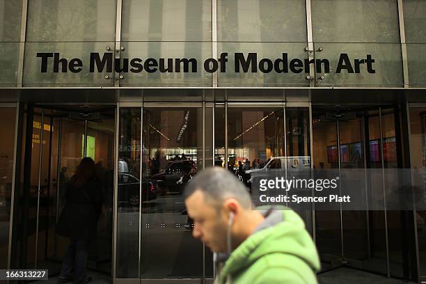 Man walks by the Museum of Modern Art on April 11, 2013 in New York City. MoMA announced yesterday that it will demolish the former Museum of...