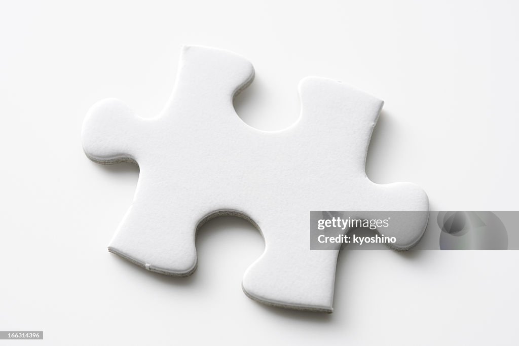 Isolated shot of blank jigsaw puzzles piece on white background