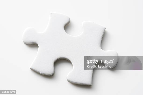 isolated shot of blank jigsaw puzzles piece on white background - pusselbit bildbanksfoton och bilder