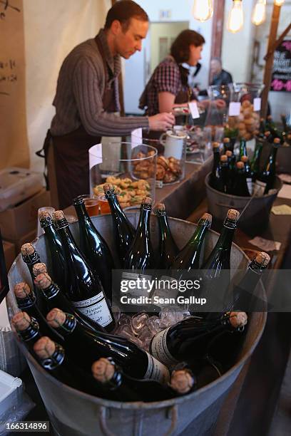 Vendor sells French-inspired delicacies and apple cider on the first day of Street Food Thursday at the Markthalle Neun market hall in Kreuzberg...