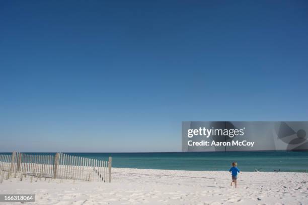 running to the sea - pensacola beach stock-fotos und bilder